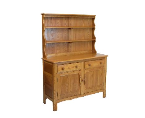 Ercol light elm sideboard, fitted two drawers over two cupboard doors with plate rack, 120cm wide  