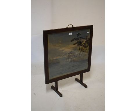 Early 20th Century oak framed firescreen having woven silk panel of an Oriental coastal scene, 61cm wide  