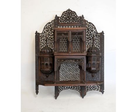 Late 19th century Indian carved hardwood wall shelves of architectural design with elaborate pierced decoration, 63cm wide x 