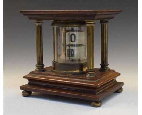 Early 20th Century lacquered brass 'Flicka' or ticket clock, having two registers of tickets to indicate the time, within cyl