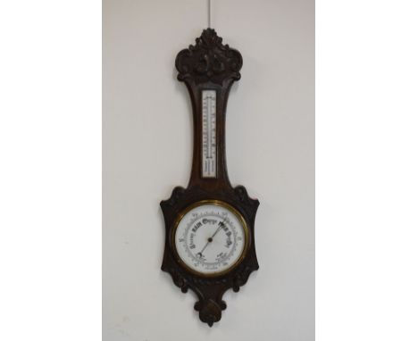Late 19th/early 20th Century oak wheel barometer having mercury thermometer with ceramic register plates, 89cm high  