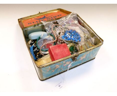 Vintage Bluebird confectionery tin containing a selection of costume jewellery, bead necklaces, ear studs, compacts, etc  