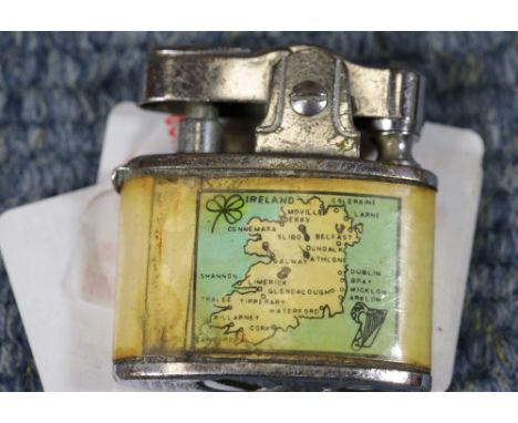Vintage Ireland souvenir miniature mechanical lighter. No wick or flint but movement works. P&amp;P Group 1 (£14+VAT for the 