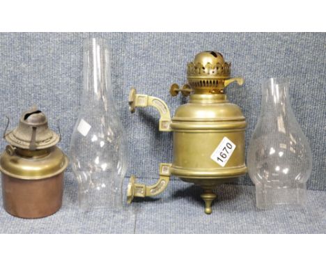 Wall mounted brass parrafin lamp, further inner for the same, and two glass chimneys. P&amp;P Group 3 (£25+VAT for the first 