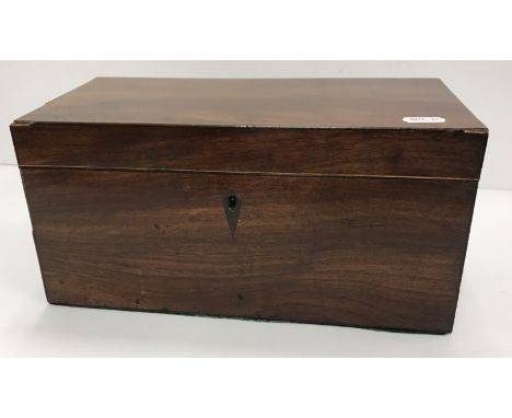 A 19th Century mahogany tea caddy of plain rectangular form, rosewood strung, the top opening to reveal two lidded canisters 