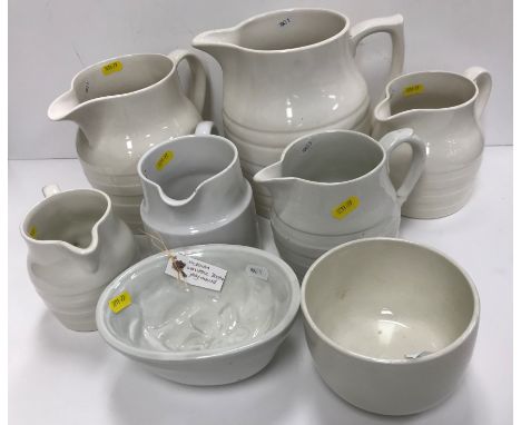 A collection of six various white glazed pottery jugs including Burleigh ironstone, hooped jugs, Booths Royal semi-porcelain,