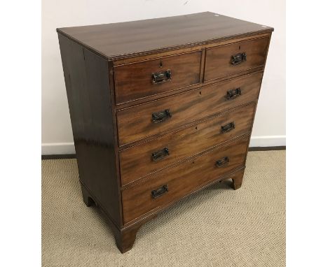 A Victorian mahogany square fronted chest of two short over three long drawers raised on bracket feet with coppered swing han
