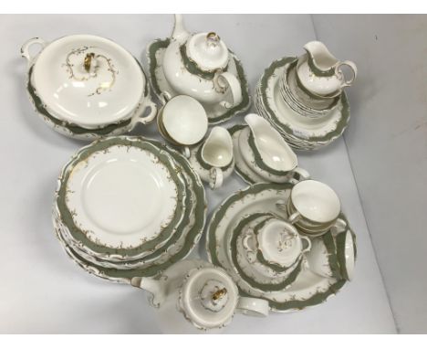 A collection of Royal Doulton "Fontainebleau" design dinner, tea and coffee wares with green and gilt scrolling decoration, c