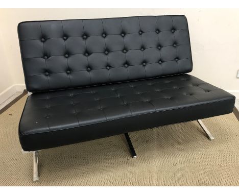 A modern chrome framed "Barcelona" two seat sofa and matching chair after the original design by Ludwig Mies Van Der Rohe and