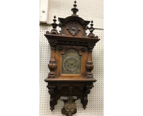A Victorian walnut cased Vienna style regulator, the eight day movement with silvered chapter ring to the brass dial and Arab