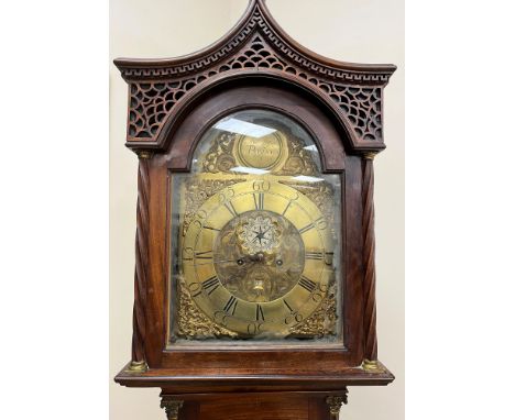 An 18th Century mahogany cased long case clock, the eight day movement with brass arched dial and circular medallion inscribe
