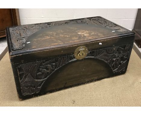 A stained and carved camphor wood trunk 100 cm wide x 41 cm deep x 55 cm high, a modern oak single pedestal desk/dressing tab