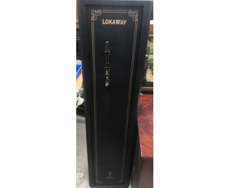 A Lokaway nine gun gunsafe with swing'n slide door (Cat 3-11361) enclosing a lined and padded interior with lockable ammuniti