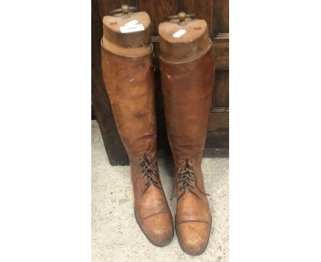 A pair of early 20th Century brown leather ladies hunting boots with trees 25.5 cm long x 8.5 cm wide CONDITION REPORTS 41 cm