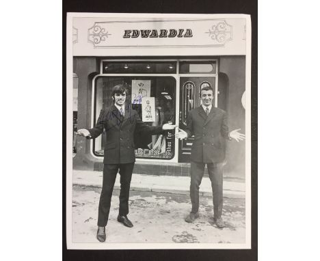 George Best Outside Edwardia Signed Football Photo: Pictured with Summerbee outside his boutique in Manchester. Removed from 