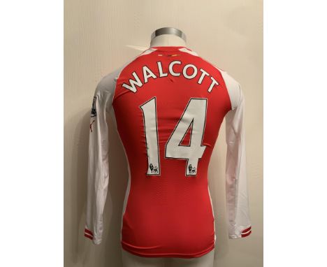 Walcott 2014/2015 Match Worn Arsenal Home Football Shirt: Red long sleeve shirt worn in a Premier League match. Number 14 to 