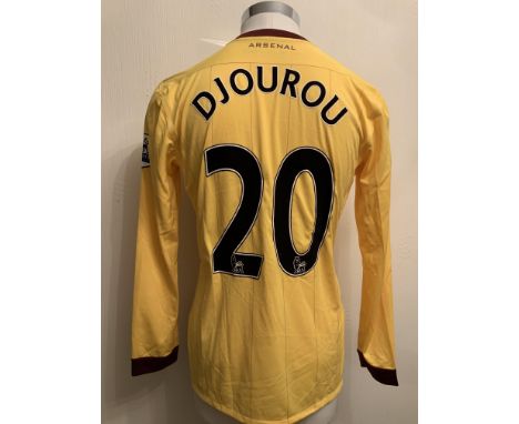 Djourou 2010/2011 Match Worn Arsenal Away Football Shirt: Yellow long sleeve shirt worn in a Premier League match. Number 20 