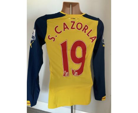 Carzorla 2014/2015 Match Worn Arsenal Away Football Shirt: Yellow long sleeve shirt worn in a Premier League match. Number 19