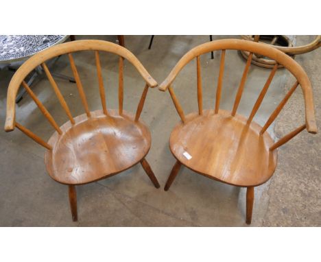 A pair of Ercol Bonde 338 model elm and beech cowhorn chairs 