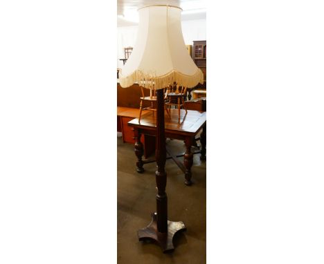 A Hepplewhite Revival carved mahogany standard lamp 