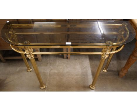 An Italian style brass and glass topped console table 