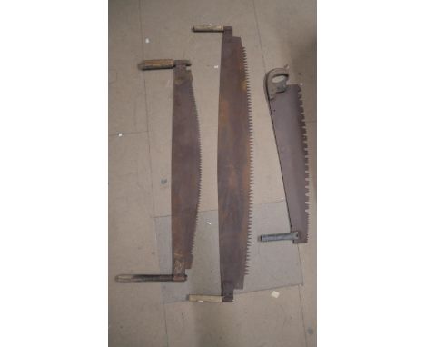 Three vintage cross cut saws 