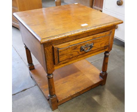 A George III style Ipswich oak single drawer lamp table 