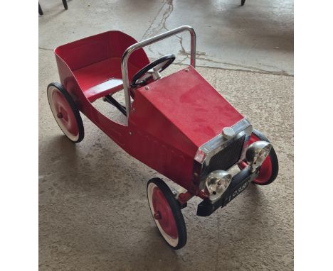 A child's toy pedal car 