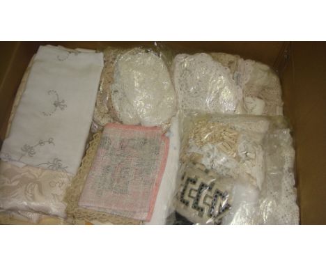 Box of linen and lace and vintage eiderdown