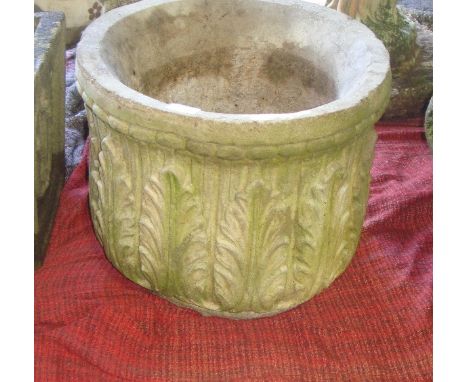 Large composite stone planter with acanthus leaf decoration