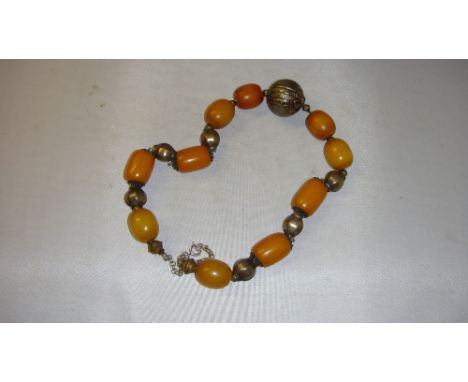 Vintage amber beaded necklace comprising of ten honey coloured amber beads each approx 2 cms long but varying in size and con