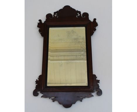A 19th century mahogany fret framed wall mirror with reeded slip and bevelled rectangular glass. 69 x 41cm
