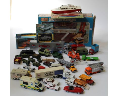 A cased Matchbox Super Kings K4A Bridge layer, a late Corgi James Bond cased Aston Martin, a repainted Sir Henry Seagrave Lan