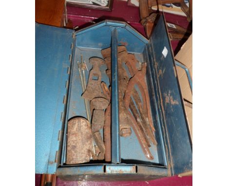 A toolbox containing a small quantity of tools including wrench, hammer and axe heads, etc.