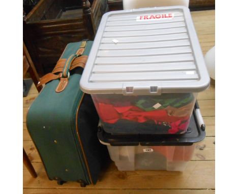 Two crates and a suitcase containing a quantity of textiles