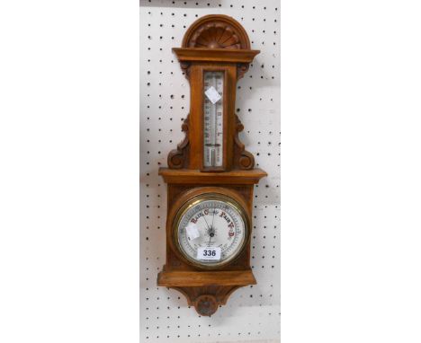 A late Victorian stained oak cased wall barometer/thermometer with printed dial marked for J. Pawson, Newark and aneroid work