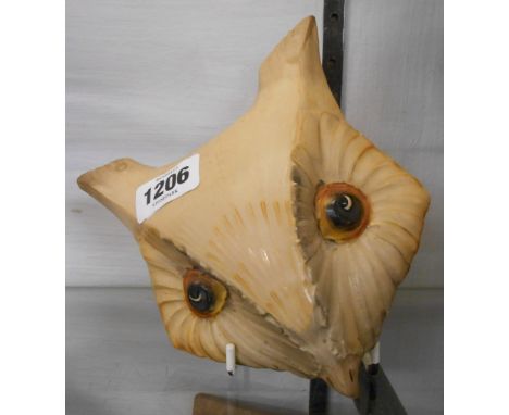 An Art Deco period Grays Pottery wall mask in the form of a stylised owl with painted finish