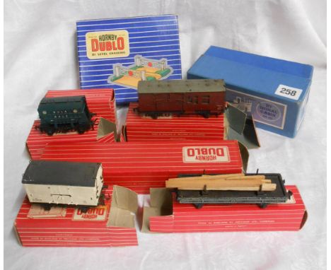 A selection of boxed Hornby Dublo carriages - sold with a Hornby Dublo level crossing and signal cabin