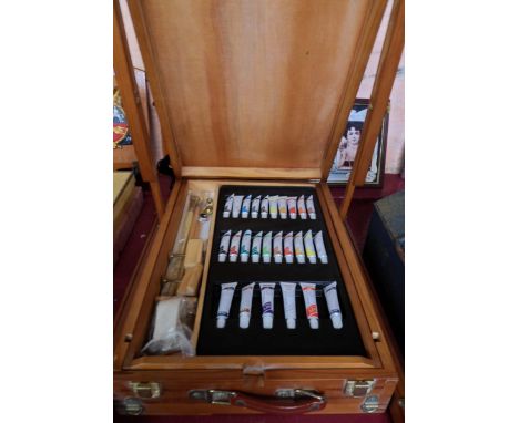 A fully fitted artist's travelling box with folding legs and art studio oil paints, etc. - paints as new