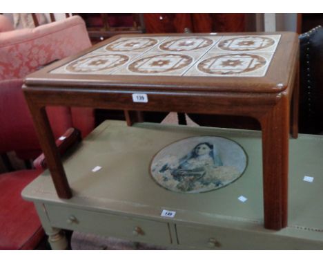 A 70cm retro stained teak tea table with tile inset top, set on moulded legs