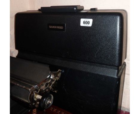 A vintage Silver Reed 500 portable typewriter in original plastic case