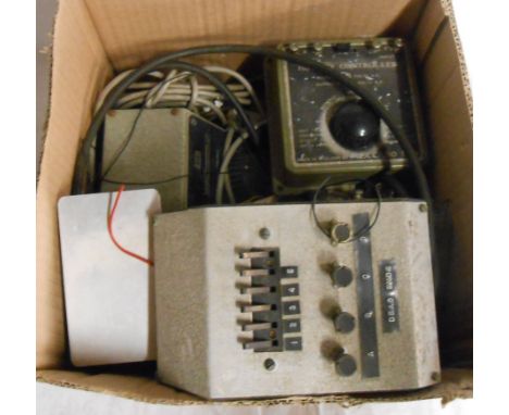 A box containing a quantity of model railway controllers including Triang, Hornby, etc.