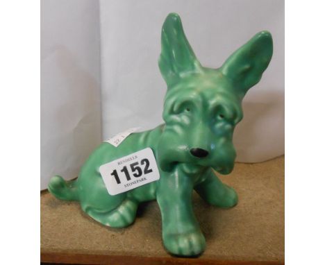 A SylvaC green glazed model of a seated terrier