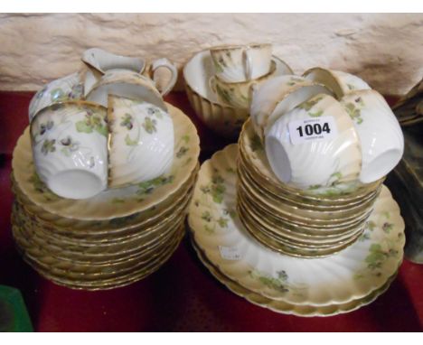 An Edwardian porcelain part tea set with Art Nouveau style decoration
