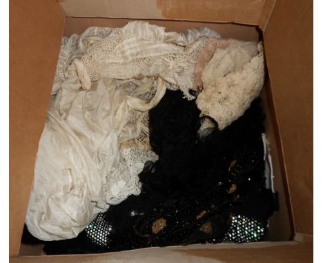 A box containing a quantity of textiles including lace items, clothing, collars, cuffs, etc.