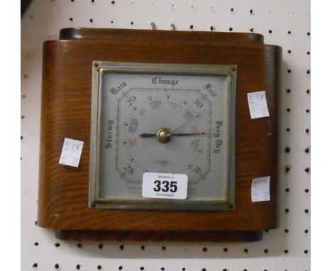 A retro polished oak cased wall barometer with S.B aneroid works