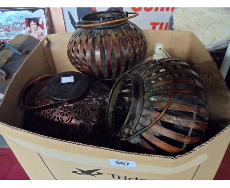 A box containing a quantity of solar and tea light hanging lanterns