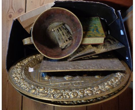 A box containing a small quantity of brassware including embossed plaques, Chad Valley tin, etc.
