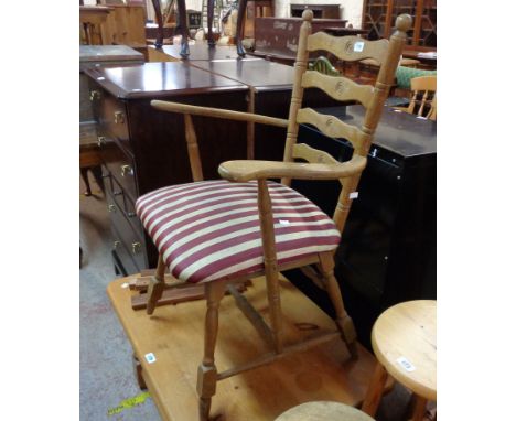 A vintage stained oak framed ladder back elbow chair a/f