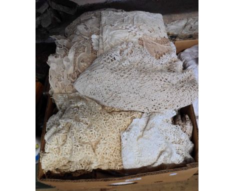 A box containing a quantity of assorted textiles including damask, crochet and drawn threadwork tablecloths